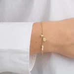 Armband mit Perlen und Scheiben-Anhänger
