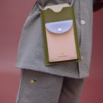 Phone pouch tickling grass
